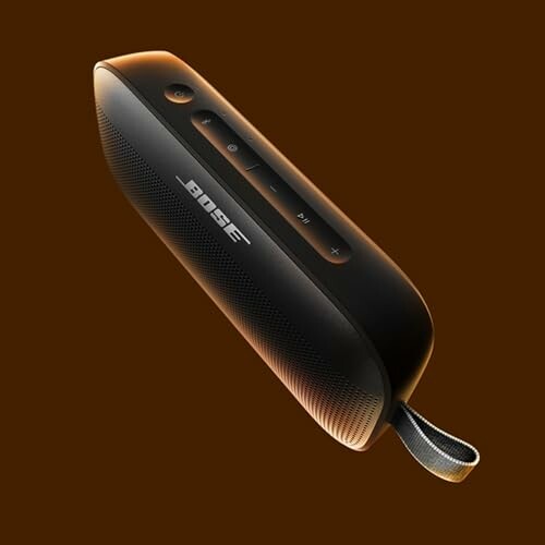 Bose portable Bluetooth speaker on brown background